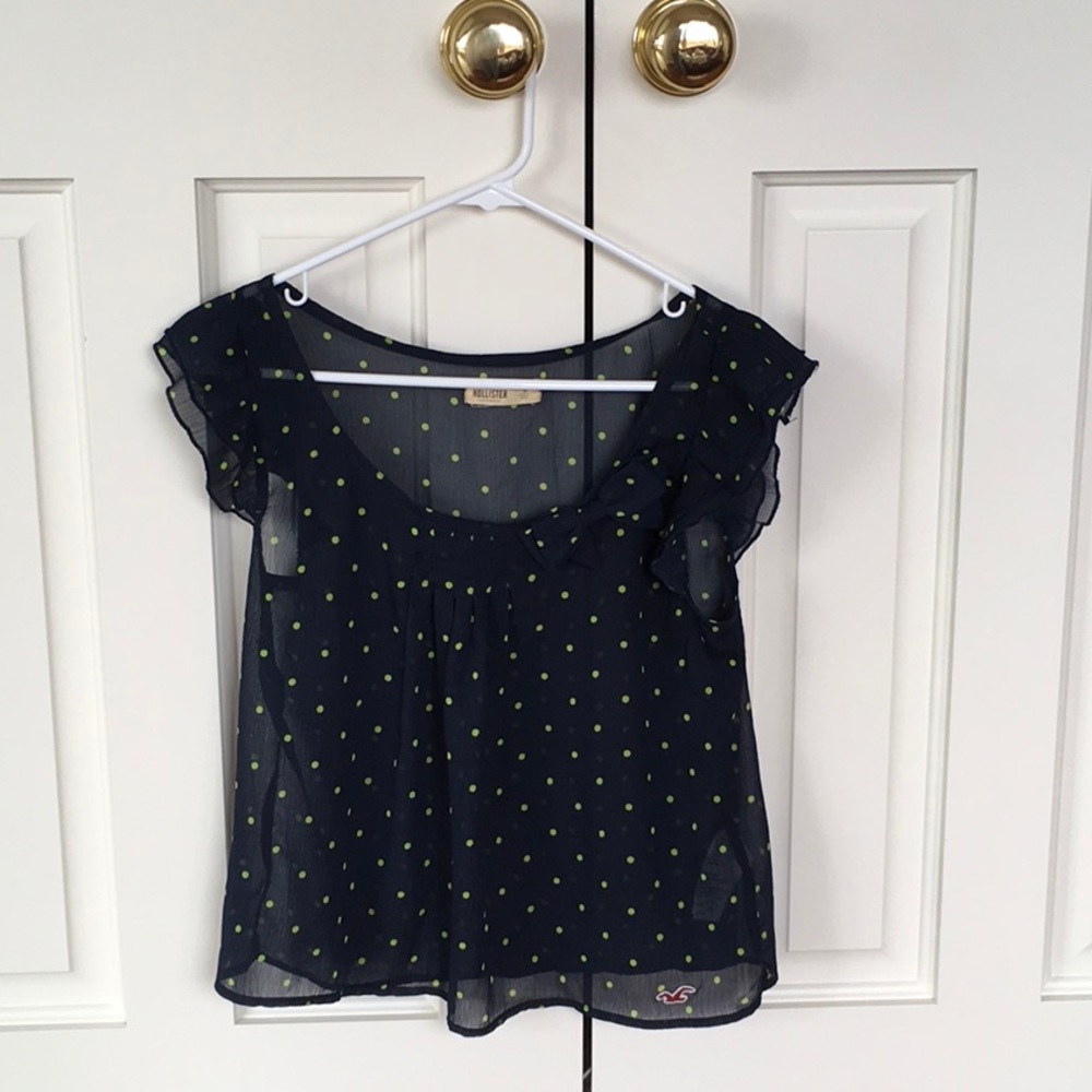 Lightweight navy and green polkadotted blouse.